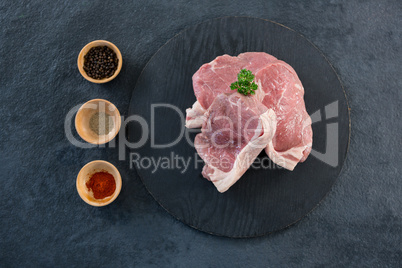 Sirloin chop and bowls of spices