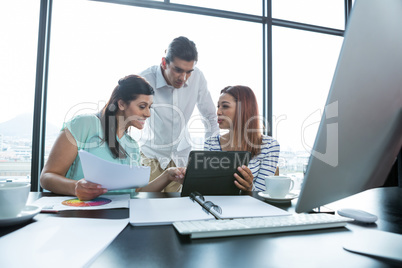 Man and women working in office