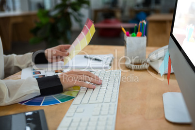 Female graphic designer working at desk