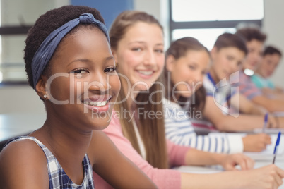 Students sitting at desk in classroom