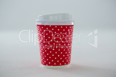 Disposable coffee cup on white background