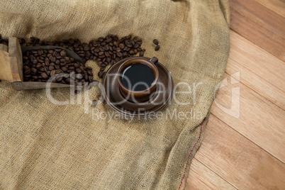 Black coffee with scoop and sack textile