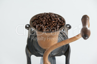 Vintage coffee grinder with coffee beans