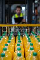 Close-up of juice bottles arranged in rows