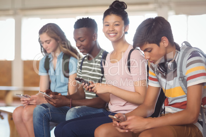 Students using mobile phone in campus