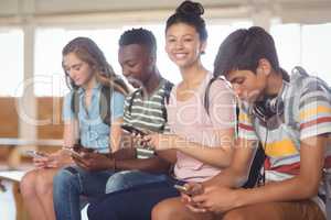 Students using mobile phone in campus