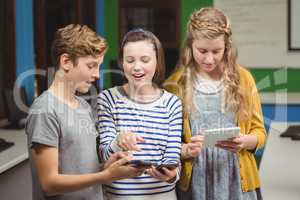 Students using mobile phone and digital tablet