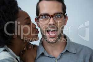 Woman about to kiss man