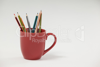 Colored pencils kept in cup