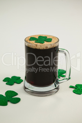 Mug of black beer and shamrock for St Patricks Day