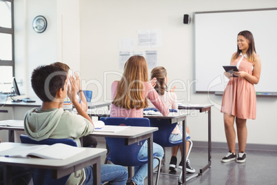 Schoolgirl giving presentation in classroom