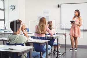 Schoolgirl giving presentation in classroom