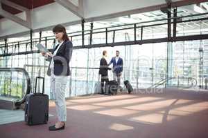 Businesswoman using digital tablet on platform