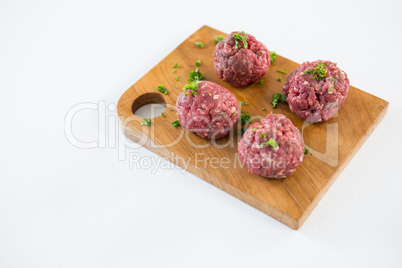 Minced beef on wooden tray