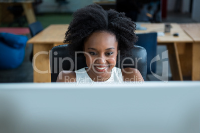 Female graphic designer using desktop pc