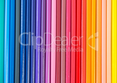 Close-up of colored pencil arranged in a row