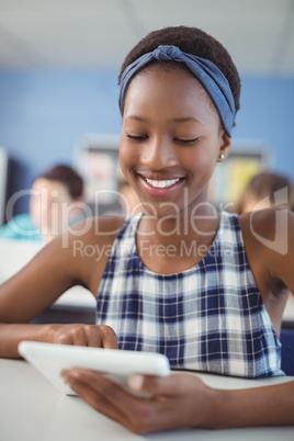 Student using digital tablet in classroom