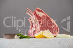 Rib chop and ingredients on white board