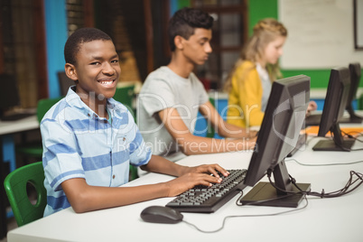 Students studying in computer classroom