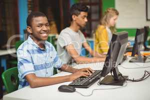 Students studying in computer classroom