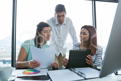 Man and women working in office