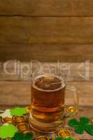 Mug of beer, chocolate gold coins and shamrock for St Patricks Day