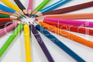 Close-up of colored pencils arranged in a circle