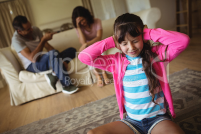 Sad girl fed up of her parents arguing