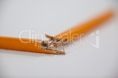 Broken pencil on white background