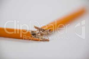 Broken pencil on white background