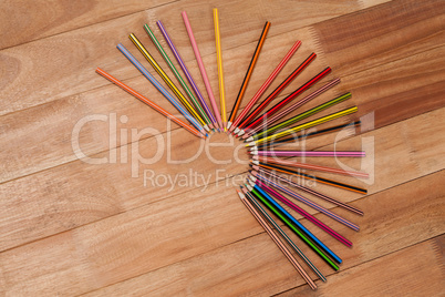 Colored pencils arranged in a semi-circle