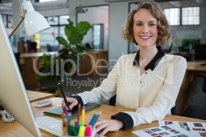 Female graphic designer working at desk