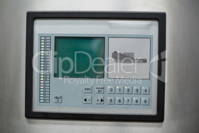 Control button and screen on factory machine