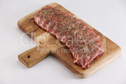 Spices sprinkled on beef ribs