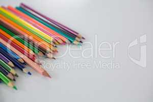 Colored pencils arranged in a wavy pattern