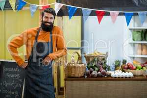 Vendor standing at the counter in grocery store