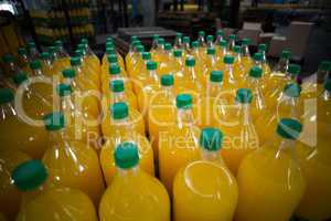 Close-up of juice bottles arranged in rows