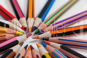 Close-up of colored pencils arranged in a circle