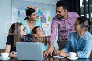 Businesspeople having discussion during meeting in people