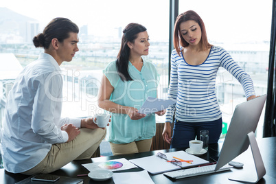 Man and women working in office