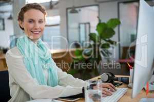 Female graphic designer working at desk