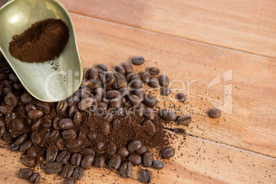 Coffee beans with powder and scoop