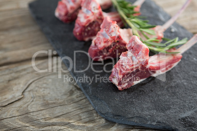 Rib chops and rosemary herb on slate board