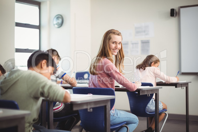 School kids doing homework in classroom