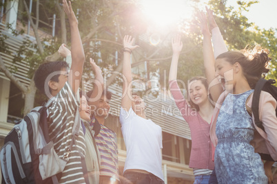 Happy school kids having fun in campus