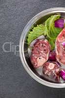 Sirloin chops and ingredients in frying pan
