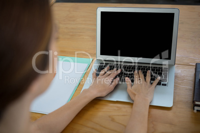 Female graphic designer using laptop Female graphic designer using laptop