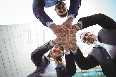 Businesses executives forming a hand stack