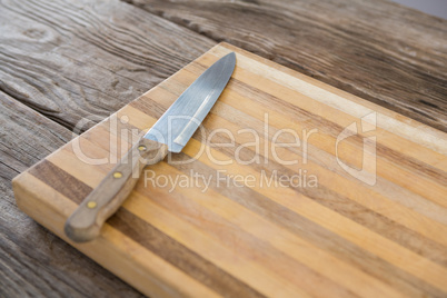 Knife on wooden tray