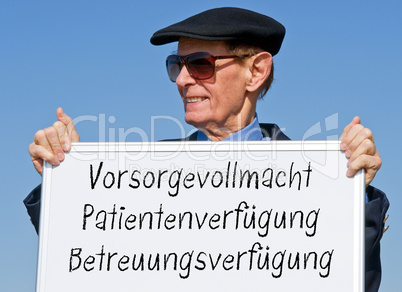 Rentner mit Schild - Vorsorgevollmacht, Patientenverfügung, Betreuungsverfügung